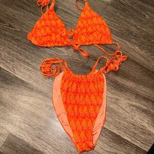 Dippin daisy orange patterned bikini set